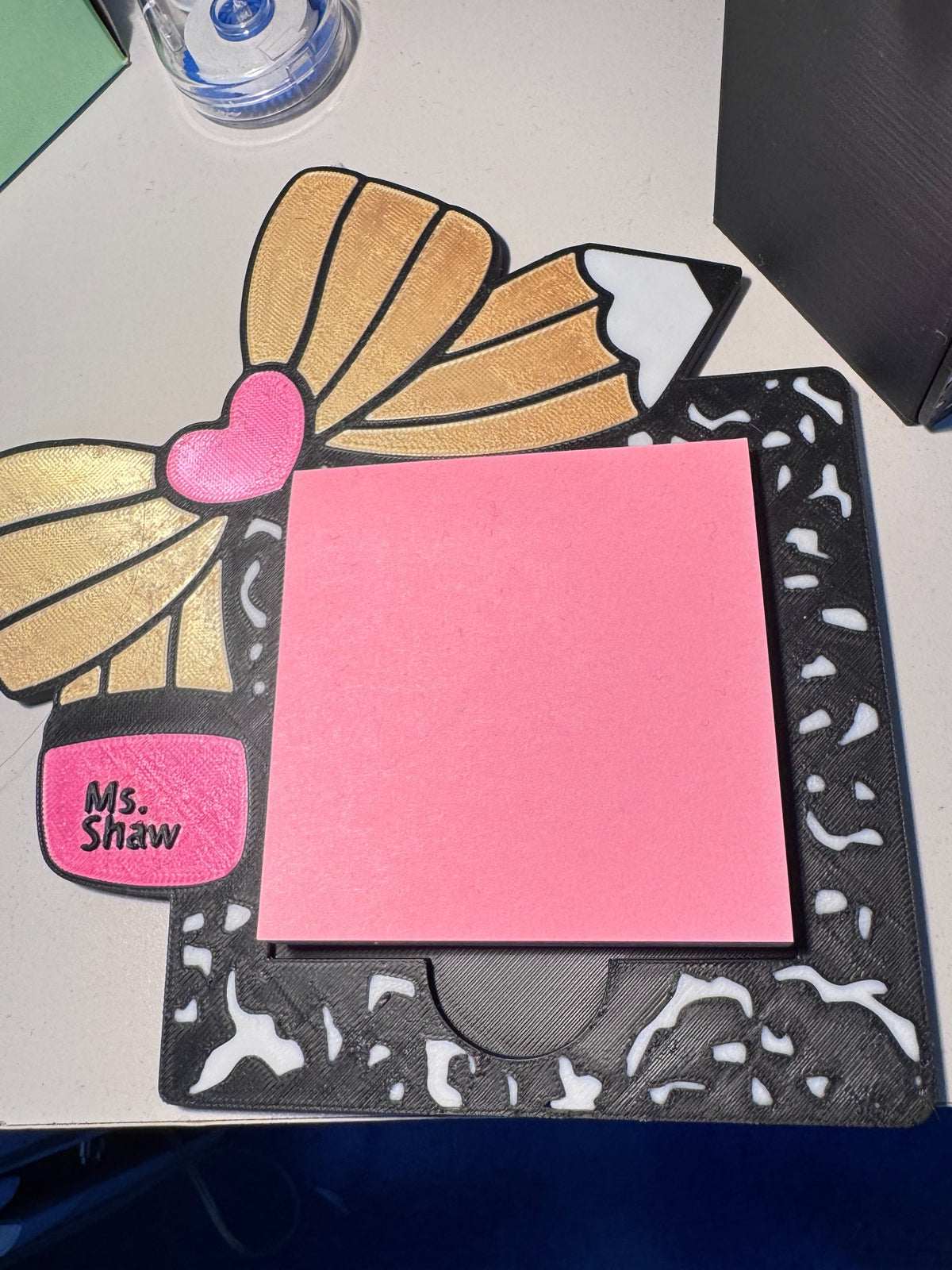 Personalized composition notebook-style sticky note holder with gold bow, pencil, pink accents, and custom name